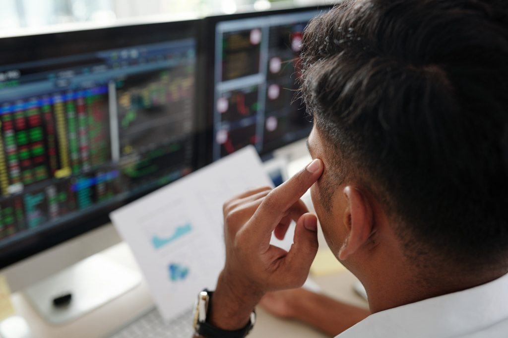 Trader analyzing stock market